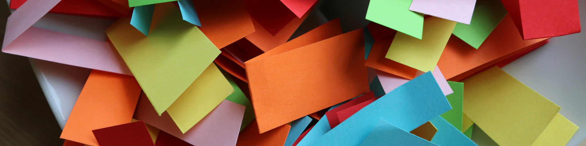 a pile of colorful pieces of paper with the word libings mescu