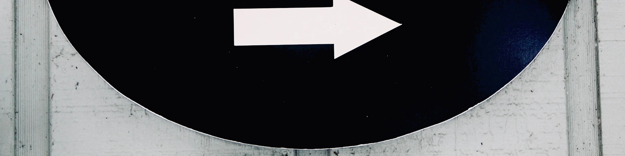 The sign points to the gym entrance.