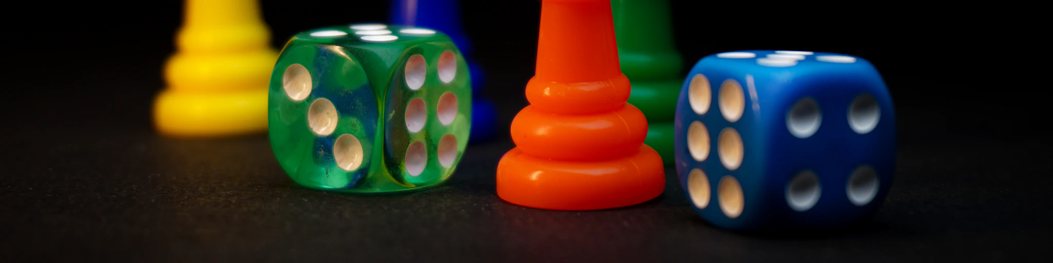 Dice and pawns are ready to play.