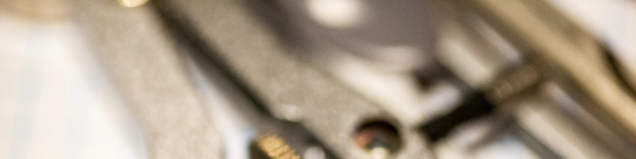 stainless steel tool on white paper