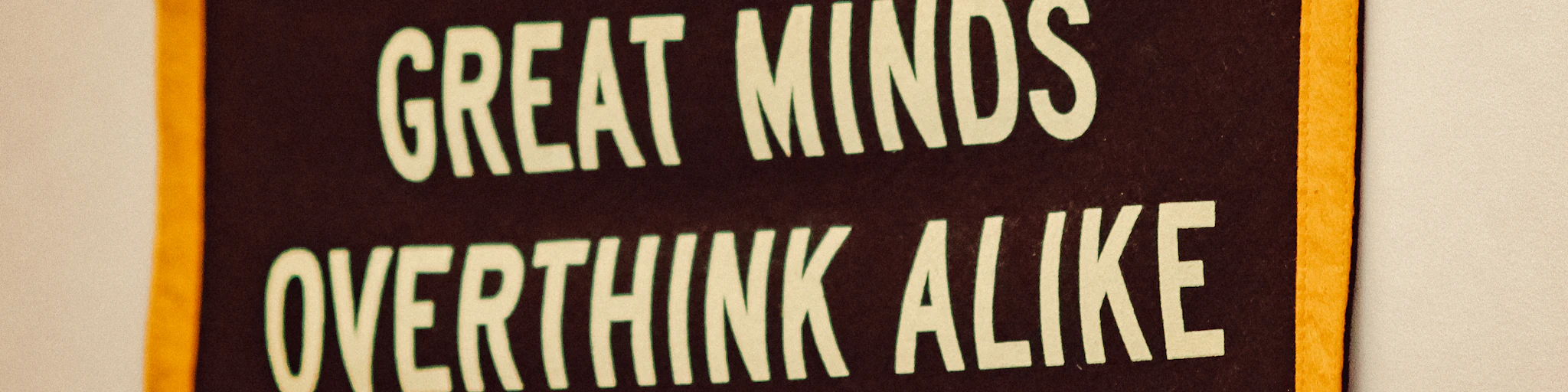 a sign that says great minds overthink alike