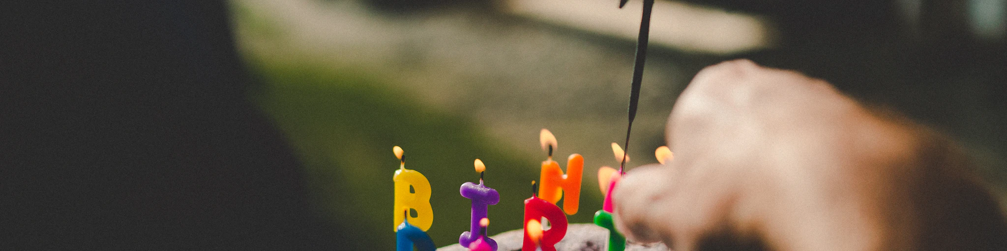 person holding birthday cake