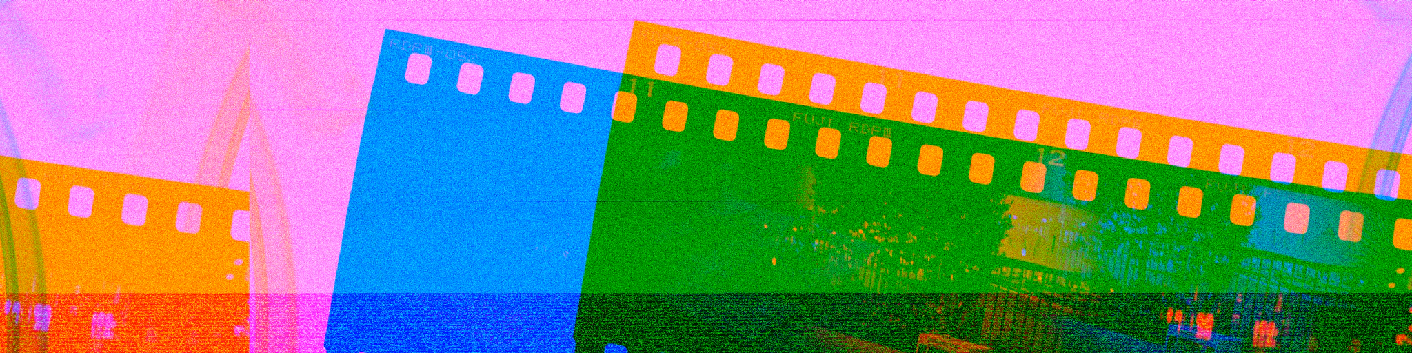 a multicolored film strip with a picture of a mountain in the background